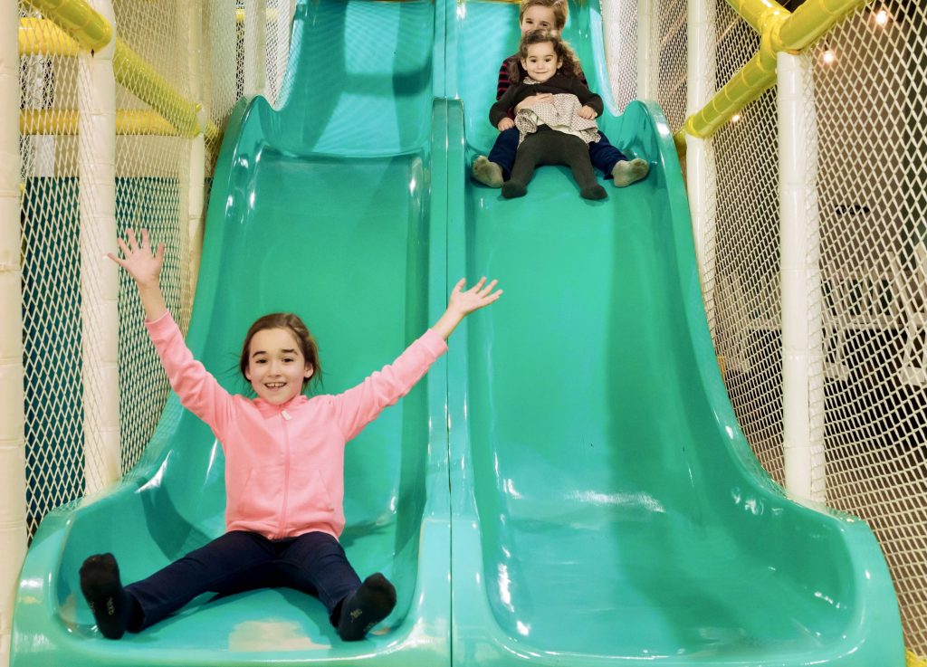 Kids running and playing in the vibrant indoor soft play area at The Jelly Lounge Windsor, ideal for family outings